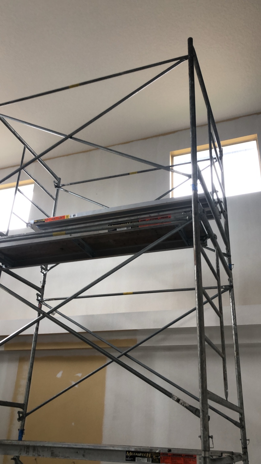 Scaffold in front of high walls during surface preparation work